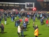 Home fans celebrate the play off semi victory
