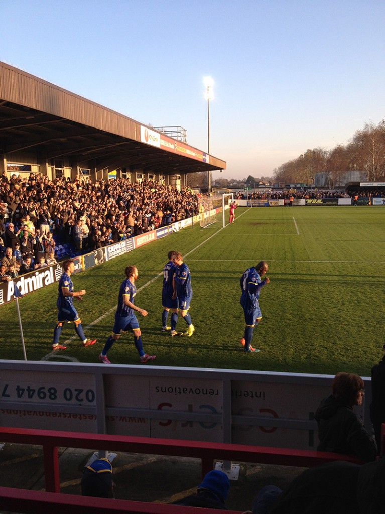 Matt Tubbs celebrates scoring after 19 second for AFC Wimbledon against Cambridge United