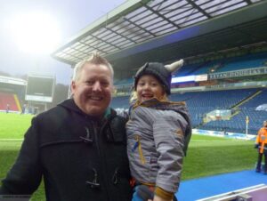 Andrew with his son at Ewood Park