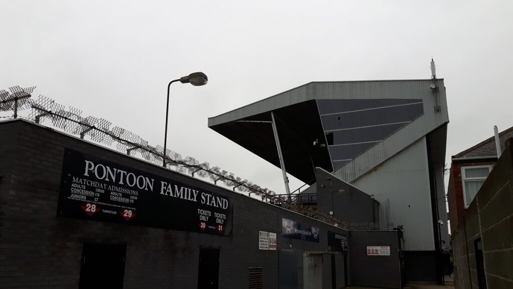 Pontoon stand entrance and the Youngs Stand at Blundell Park