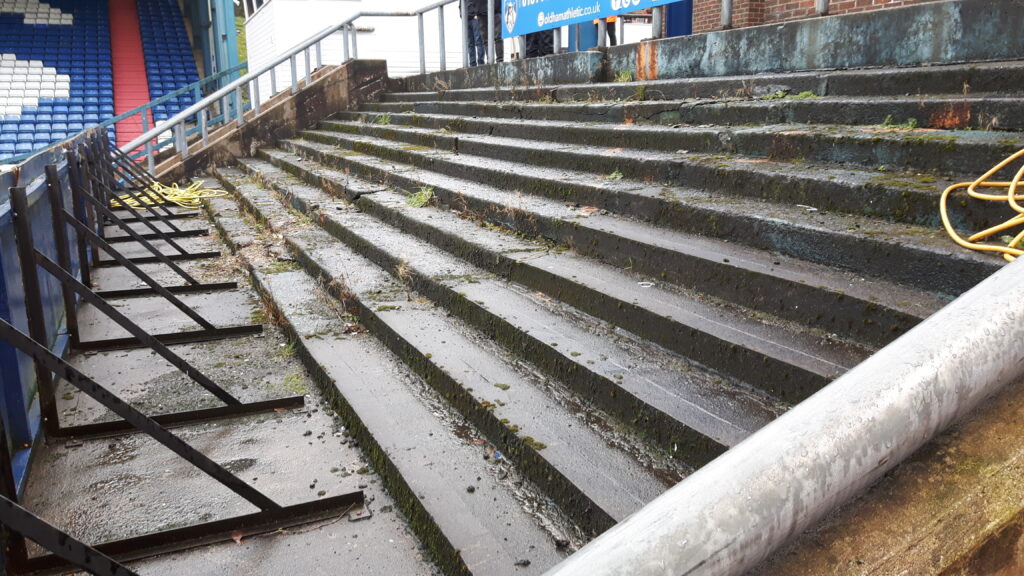 Part of the old terrace that sits to the side of the Main Stand at Oldham Athletic's ground