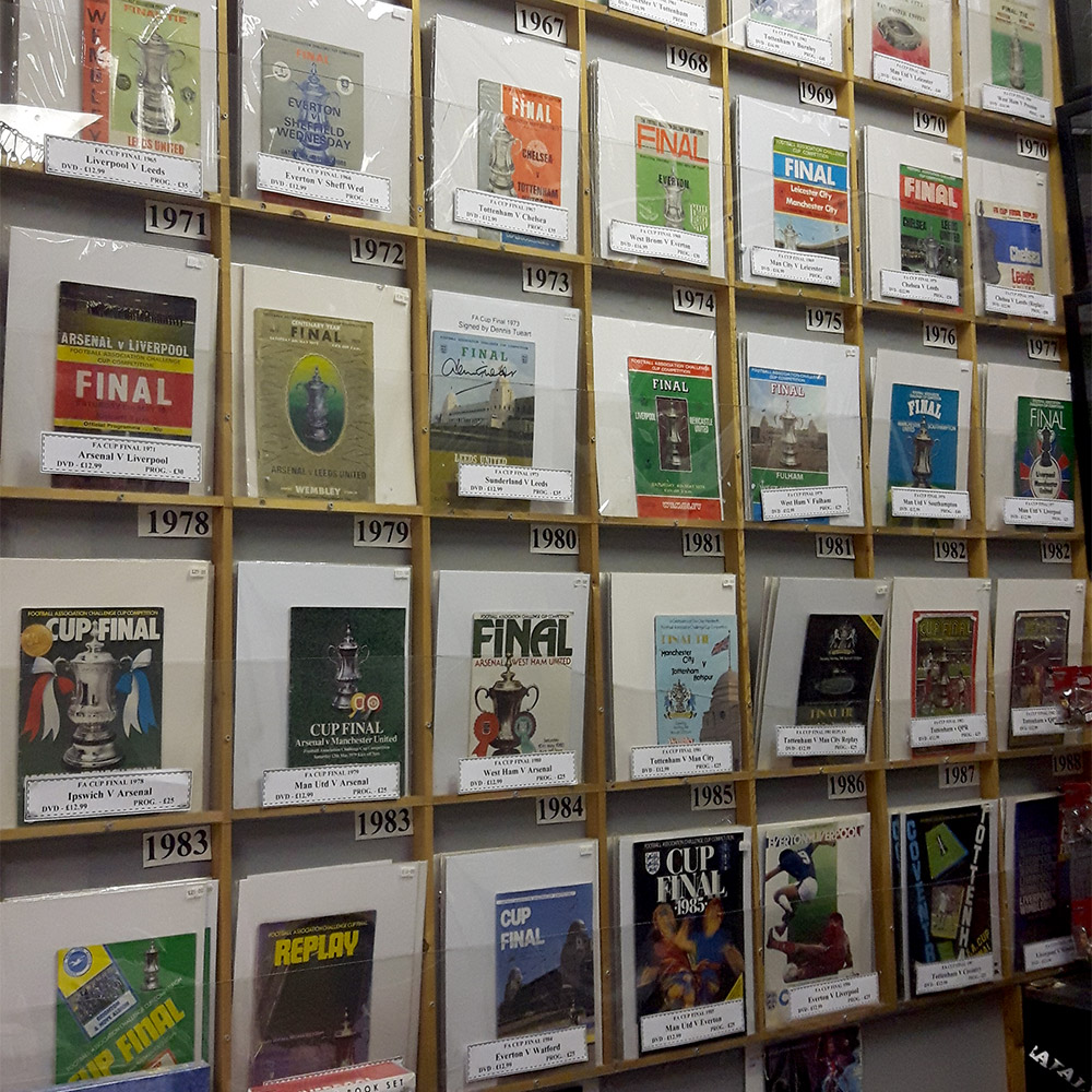 Wall of FA Cup Final programmes at the Back Page Shop Newcastle
