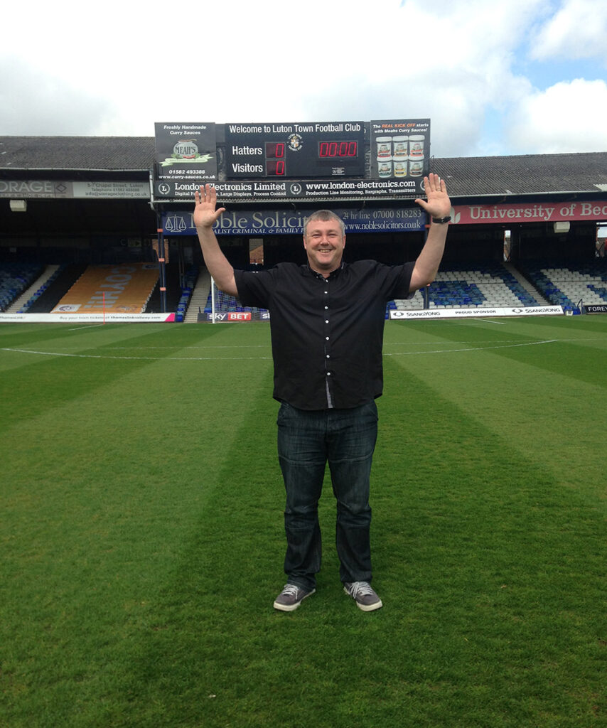 On the pitch at Kenilworth Road doing the 92 club challenge