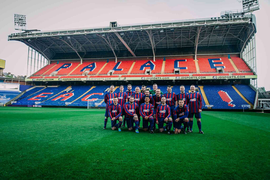 John Salako poses with his squad for the pre-match photo at Selhurst Park the home of Crystal Palace