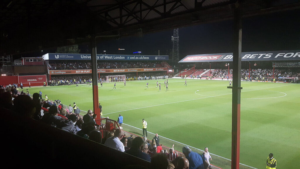 Bristol City fans and players celebrate grabbing a late equaliser at Griffin Park